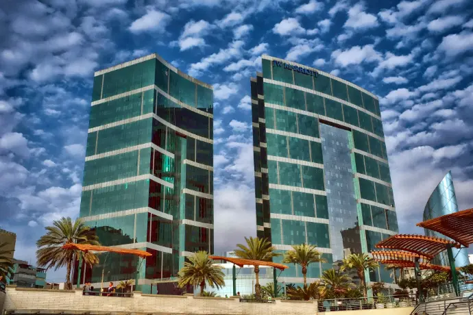 blue and white concrete building under blue sky during daytime